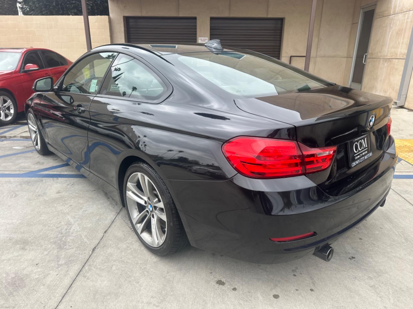 2015 Black BMW 4-Series 435i coupe (WBA3R1C55FK) with an 3.0L V6 DOHC 24V engine, 8-Speed Automatic transmission, located at 30 S. Berkeley Avenue, Pasadena, CA, 91107, (626) 248-7567, 34.145447, -118.109398 - Crown City Motors is a used “Buy Here Pay Here” car dealer in Pasadena CA. “Buy Here Pay Here” financing, means that when you purchase your vehicle from our dealership, that you make the payments to the dealership as well. We do not need the banks approval to get you approved for a used auto - Photo #2